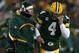 GREEN BAY, WI - JANUARY 20: Quarterback Brett Favre #4 of the Green Bay Packers talks with head coach Mike McCarthy during the NFC championship game against the New York Giants on January 20, 2008 at Lambeau Field in Green Bay, Wisconsin. (Photo by Jonathan Daniel/Getty Images)