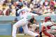 LOS ANGELES, CA - JUNE 30: Matt Kemp #27 of the Los Angeles Dodgers hits an RBI single in the fourth inning against the Philadelphia Phillies at Dodger Stadium on June 30, 2013 in Los Angeles, California. The Dodgers won 6-1. (Photo by Stephen Dunn/Getty Images)