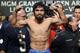 LAS VEGAS, NV - DECEMBER 07: Boxer Manny Pacquiao poses on the scale during the official weigh-in for his welterweight bout against Juan Manuel Marquez at the MGM Grand Garden Arena on December 7, 2012 in Las Vegas, Nevada. Pacquiao and Marquez will fight each other for the fourth time on December 8 in Las Vegas. (Photo by Jeff Bottari/Getty Images)