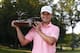 SILVIS, IL - JULY 15: Zach Johnson holds the trophy after winning the John Deere Classic with a birdie on the second hole of a sudden death playoff after the final round of the John Deere Classic held at TPC Deere Run on July 15, 2012 in Silvis, Illinois. (Photo by Michael Cohen/Getty Images)