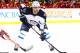 NEWARK, NJ - FEBRUARY 24: Alex Burmistrov #8 of the Winnipeg Jets in action against the New Jersey Devils during their game at the Prudential Center on February 24, 2013 in Newark, New Jersey. (Photo by Al Bello/Getty Images)