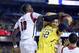 Apr 8, 2013; Atlanta, GA, USA; Michigan Wolverines forward Jordan Morgan (52) battles for a rebound with Louisville Cardinals center Gorgui Dieng (10) during the second half of the championship game in the 2013 NCAA mens Final Four at the Georgia Dome. Mandatory Credit: Robert Deutsch-USA TODAY Sports