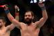 Mar 16, 2013; Montreal, Quebec, CAN; Johny Hendricks (blue) celebrates after his main card bout against Carlos Condit (red) at UFC 158 at the Bell Centre. Mandatory Credit: Eric Bolte-USA TODAY Sports