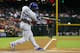 PHOENIX, AZ - JULY 09: Yasiel Puig #66 of the Los Angeles Dodgers hits a single against the Arizona Diamondbacks during the first inning of the MLB game at Chase Field on July 9, 2013 in Phoenix, Arizona. (Photo by Christian Petersen/Getty Images)