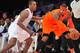 December 25, 2012; Los Angeles, CA, USA; New York Knicks small forward Carmelo Anthony (7) controls the ball against the defense of Los Angeles Lakers small forward Metta World Peace (15) during the second half at Staples Center. Mandatory Credit: Gary A. Vasquez-USA TODAY Sports
