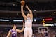 DALLAS, TX - JANUARY 27: Chris Kaman #35 of the Dallas Mavericks takes a shot against Goran Dragic #1 of the Phoenix Suns at American Airlines Center on January 27, 2013 in Dallas, Texas. NOTE TO USER: User expressly acknowledges and agrees that, by downloading and or using this photograph, User is consenting to the terms and conditions of the Getty Images License Agreement. (Photo by Ronald Martinez/Getty Images)