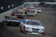 LOUDON, NH - JULY 13: Elliott Sadler, driver of the #11 SportsClips Toyota, leads a pack of cars into turn one during the NASCAR Nationwide Series CNBC Prime's The Profit 200 at New Hampshire Motor Speedway on July 13, 2013 in Loudon, New Hampshire. (Photo by Jared C. Tilton/Getty Images)