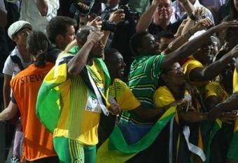 Bolt-is-mobbed-by-locals-as-well-several-jamaican-in-attendance-at-the-olympic-stadium-in-berlin-at-the-iaaf-world-track-field-championships_crop_north