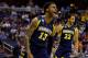 WASHINGTON, DC - MARCH 28: Vander Blue #13 of the Marquette Golden Eagles reacts after a dunk against the Miami (Fl) Hurricanes during the East Regional Round of the 2013 NCAA Men's Basketball Tournament at Verizon Center on March 28, 2013 in Washington, DC. (Photo by Rob Carr/Getty Images)