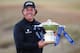 INVERNESS, SCOTLAND - JULY 14: Phil Mickelson of the United States poses with the trophy after his victory on the 1st hole of a sudden-death playoff during the final round of the Aberdeen Asset Management Scottish Open at Castle Stuart Golf Links on July 14, 2013 in Inverness, Scotland. (Photo by Andrew Redington/Getty Images)