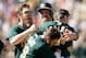 OAKLAND, CA - JULY 14: Josh Donaldson #20 of the Oakland Athletics is mobbed by Eric Sogard #28, Josh Reddick #16, and Derek Norris #36 after Donaldson hit the game-winning hit in the 11th inning that scored Chris Young #25 to beat the Boston Red Sox at O.co Coliseum on July 14, 2013 in Oakland, California. (Photo by Ezra Shaw/Getty Images)