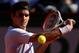 PARIS, FRANCE - JUNE 04: Roger Federer of Switzerland plays a backhand in his Men's Singles quarter final match against Jo-Wilfried Tsonga of France during day ten of the French Open at Roland Garros on June 4, 2013 in Paris, France. (Photo by Clive Brunskill/Getty Images)