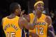 LOS ANGELES, CA - NOVEMBER 16: Metta World Peace #15 of the Los Angeles Lakers helps Dwight Howard #12 with his contact lens during the basketball game against Phoenix Suns at Staples Center on November 16, 2012 in Los Angeles, California. NOTE TO USER: User expressly acknowledges and agrees that, by downloading and or using this photograph, User is consenting to the terms and conditions of the Getty Images License Agreement. (Photo by Kevork Djansezian/Getty Images)