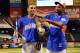 Jul 15, 2013; Flushing, NY, USA; American League outfielder Yoenis Cespedes (52) of the Oakland Athletics holds the Home Run Derby trophy after winning the Home Run Derby while American League outfielder Adam Jones (10) of the Baltimore Orioles hands him a championship belt in advance of the 2013 All Star Game at Citi Field. Mandatory Credit: Scott Rovak-USA TODAY Sports