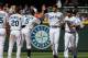 SEATTLE, WA - JULY 14: Members of the Seattle Mariners celebrate after defeating the Los Angeles Angels of Anaheim 4-3 at Safeco Field on July 14, 2013 in Seattle, Washington. (Photo by Otto Greule Jr/Getty Images)