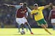 NORWICH, ENGLAND - MAY 04: Wes Hoolahan of Norwich City tangles with Christian Benteke of Aston Villa during the Barclays Premier League match between Norwich City and Aston Villa at Carrow Road on May 04, 2013 in Norwich, England. (Photo by Mark Thompson/Getty Images)