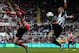 NEWCASTLE UPON TYNE, ENGLAND - APRIL 14: Adam Johnson of Sunderland and Yoan Gouffran of Newcastle challenge for the ball during the Barclays Premier League match between Newcastle United and Sunderland at St James' Park on April 14, 2013 in Newcastle upon Tyne, England. (Photo by Matthew Lewis/Getty Images)