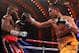 Apr 13, 2013; New York, NY, USA; Nonito Donaire (Yellow/Black Trunks) and Guillermo Rigondeaux (Green/White trunks) trade punches during their 12-round WBO/WBA Super Bantamweight title fight at Radio City Music Hall. Mandatory Credit: Ed Mulholland-USA TODAY Sports