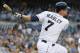 SAN DIEGO, CA - JULY 10: Chase Headley #7 of the San Diego Padres hits a single during the first inning of a baseball game against the Colorado Rockies at Petco Park on July 10, 2013 in San Diego, California. (Photo by Denis Poroy/Getty Images)
