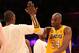 LOS ANGELES, CA - APRIL 09: Kobe Bryant #24 of the Los Angeles Lakers high fives with Metta World Peace #15 after the game against the New Orleans Hornets at Staples Center on April 9, 2013 in Los Angeles, California. The Lakers won 104-96. NOTE TO USER: User expressly acknowledges and agrees that, by downloading and or using this photograph, User is consenting to the terms and conditions of the Getty Images License Agreement. (Photo by Stephen Dunn/Getty Images)