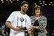 Mar 17, 2013; Brooklyn, NY, USA; A10 commissioner Bernadette McGlade presents Saint Louis Billikens forward Dwayne Evans (21) with the Outstanding Player award for the championship game of the Atlantic 10 at the Barclays Center. Saint Louis won 62-56. Mandatory Credit: Anthony Gruppuso-USA TODAY Sports
