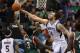 Nov 30, 2012; Minneapolis, MN, USA; Milwaukee Bucks guard Brandon Jennings (3) gets his shot blocked by Minnesota Timberwolves center Nikola Pekovic (14) during the second quarter at the Target Center. Mandatory Credit: Brace Hemmelgarn-USA TODAY Sports