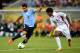 RECIFE, BRAZIL - JUNE 23: Luis Suarez of Uruguay competes against Henri Caroine of Tahiti during the FIFA Confederations Cup Brazil 2013 Group B match between Uruguay and Tahiti at Arena Pernambuco on June 22, 2013 in Recife, Brazil. (Photo by Laurence Griffiths/Getty Images)