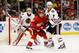 March 31, 2013; Detroit, MI, USA; Detroit Red Wings right wing Patrick Eaves (17) and Chicago Blackhawks defenseman Brent Seabrook (7) fight for position in front of goalie Corey Crawford (50) at Joe Louis Arena. Mandatory Credit: Rick Osentoski-USA TODAY Sports