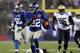 EAST RUTHERFORD, NJ - DECEMBER 09: David Wilson #22 of the New York Giants carries the ball past Isa Abdul-Quddus #42 of the New Orleans Saints to score his third touchdown of the game on December 9, 2012 at MetLife Stadium in East Rutherford, New Jersey. (Photo by Elsa/Getty Images)