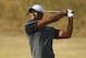 GULLANE, SCOTLAND - JULY 20: Tiger Woods of the United States hits a shot on the 12th fairway during the third round of the 142nd Open Championship at Muirfield on July 20, 2013 in Gullane, Scotland. (Photo by Matthew Lewis/Getty Images)