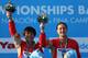 BARCELONA, SPAIN - JULY 20: Gold medallists Minxia Wu and Tingmao Shi of China pose with the official mascot XOP after winning the Women's 3m Springboard Synchronised Diving final on day one of the 15th FINA World Championships at Piscina Municipal de Montjuic on July 20, 2013 in Barcelona, Spain. (Photo by Clive Rose/Getty Images)