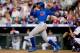 DENVER, CO - JULY 19: Alfonso Soriano #12 of the Chicago Cubs hits a solo home run in the fourth inning against the Colorado Rockies looks on at Coors Field on July 19, 2013 in Denver, Colorado. (Photo by Justin Edmonds/Getty Images)