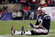 FOXBORO, MA - JANUARY 20: Tom Brady #12 of the New England Patriots sits on the ground after getting knocked down in the fourth quarter against the Baltimore Ravens during the 2013 AFC Championship game at Gillette Stadium on January 20, 2013 in Foxboro, Massachusetts. (Photo by Jim Rogash/Getty Images)