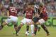 REGGIO NELL'EMILIA, ITALY - JULY 23: Carlos Alberto Tevez (2nd R) of Juventus competes with Daniele Bonera #25, Antonio Nocerino and Phelippe Mexes #5 of AC Milan during the TIM Preseason Tournament between US Sassuolo, Juventus and AC Milan at Mapei Stadium - Citta del Tricolore on July 23, 2013 in Reggio nell'Emilia, Italy.