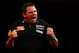 LONDON, ENGLAND - DECEMBER 29: Adrian Lewis of England celebrates winning a set during the quarter final match between Adrian Lewis of England and Michael Van Gerwen of Netherlands on day thirteen of the 2013 Ladbrokes.com World Darts Championship at Alexandra Palace on December 29, 2012 in London, England. (Photo by Paul Gilham/Getty Images)