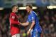 LONDON, ENGLAND - OCTOBER 28: Fernando Torres of Chelsea is helped to his feet by Wayne Rooney of Manchester United after being shown the red card during the Barclays Premier League match between Chelsea and Manchester United at Stamford Bridge on October 28, 2012 in London, England. (Photo by Michael Regan/Getty Images)