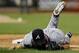 NEW YORK, NY - JULY 24: Tim Hudson #15 of the Atlanta Braves lays on the ground after being injured on a play at first base in the eighth inning against the New York Mets at Citi Field on July 24, 2013 at Citi Field in the Flushing neighborhood of the Queens borough of New York City. (Photo by Mike Stobe/Getty Images)