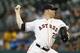 HOUSTON, TX - JULY 24: Bud Norris #20 of the Houston Astros throws in the first inning against the Oakland Athletics at Minute Maid Park on July 24, 2013 in Houston, Texas. (Photo by Bob Levey/Getty Images)