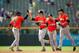 Christian Yelich, second from left, and Jake Marisnick, right, were promoted to the majors earlier this week. They join Adeiny Hechavarria, left, as the future of the Miami Marlins has arrived.