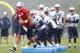 FOXBORO, MA - JULY 26: Tim Tebow #5 leads the team through a drill during the first day of New England Patriots Training Camp at Gillette Stadium on July 26, 2013 in Foxboro, Massachusetts. (Photo by Jim Rogash/Getty Images)