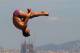 BARCELONA, SPAIN - JULY 20: Tom Daley of Great Britain competes in the Men's 1m Springboard Diving preliminary round on day one of the 15th FINA World Championships at Piscina Municipal de Montjuic on July 20, 2013 in Barcelona, Spain. (Photo by Clive Rose/Getty Images)