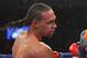 Mar 9, 2013; Brooklyn, NY, USA; Keith Thurman (red/white/blue trunks) and Jan Zaveck (blue trunks) trade punches during their 12 round WBO Inter-Continental Welterweight title bout at the Barclay's Center. Mandatory Credit: Ed Mulholland-USA TODAY Sports