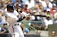 MILWAUKEE, WI - JULY 25: Carlos Gomez #27 of the Milwaukee Brewers hits a single in the bottom of the second inning against the San Diego Padres at Miller Park on July 25, 2013 in Milwaukee, Wisconsin. (Photo by Mike McGinnis/Getty Images)
