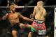 Jul 27, 2013; Seattle, WA, USA; Demetrious Johnson (red tape) kicks John Moraga (blue tape) during their welterweight bout at Key Arena. Johnson won by a tap out. Mandatory Credit: Jayne Kamin-Oncea-USA TODAY Sports