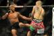 Jul 27, 2013; Seattle, WA, USA; Demetrious Johnson (red tape) kicks John Moraga (blue tape) during their welterweight bout at Key Arena. Johnson won by a tap out. Mandatory Credit: Jayne Kamin-Oncea-USA TODAY Sports