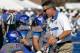 BOISE, ID - OCTOBER 22: Head Coach Chris Petersen of the Boise State Broncos shakes hands with Nick Alexander #81 before the game against the Air Force Falcons at Bronco Stadium on October 22, 2011 in Boise, Idaho. (Photo by Otto Kitsinger III/Getty Images)