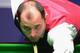 SHEFFIELD, ENGLAND - APRIL 27: Joe Perry of England plays a shot in his round two match against Stephen Maguire of Scotland during the Betfred.com World Snooker Championship at the Crucible Theatre on April 27, 2012 in Sheffield, England. (Photo by Michael Regan/Getty Images)