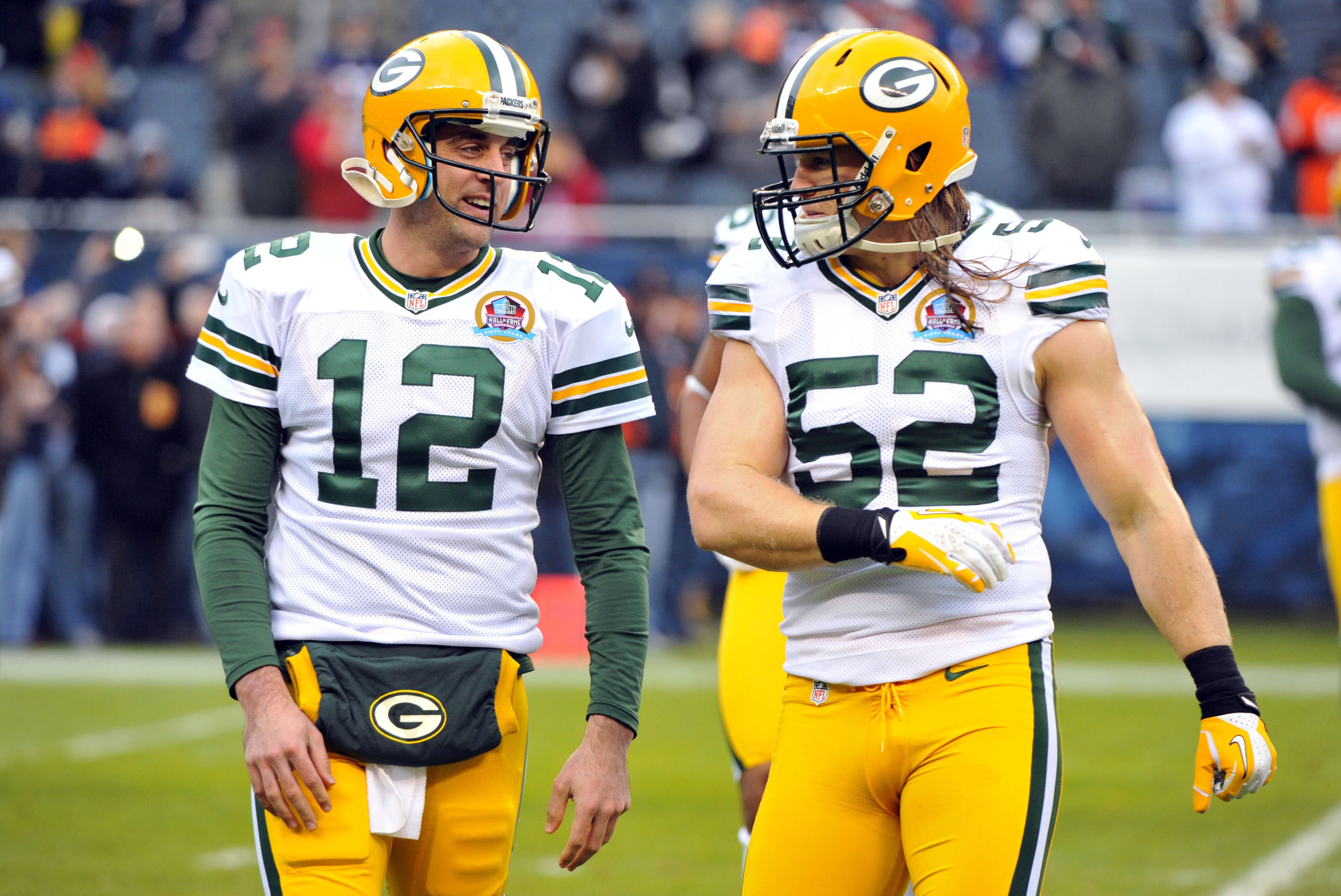 Dec 16, 2012; Chicago, IL, USA; Green Bay Packers quarterback Aaron Rodgers (12) talk with outside linebacker Clay Matthews (52) before the game against the Chicago Bears at Soldier Field.  Mandatory Credit: Rob Grabowski-USA TODAY Sports