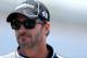 INDIANAPOLIS, IN - JULY 27: Jimmie Johnson, driver of the #48 Lowe's/Kobalt Tools Chevrolet, stands on the grid during qualifying for the NASCAR Sprint Cup Series Samuel Deeds 400 At The Brickyard at Indianapolis Motor Speedway on July 27, 2013 in Indianapolis, Indiana. (Photo by Patrick Smith/Getty Images)