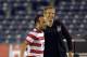 Jul 5, 2013; San Diego, CA, USA; United States forward Landon Donova (10) is congratulated by coach Jurgen Klinsmann in a friendly against Guatemala at Qualcomm Stadium.The United States defeated Guatemala 6-0. Mandatory Credit: Kirby Lee-USA TODAY Sports